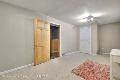 Bedroom - 11877 W Herbison Rd, Eagle, MI 48822 photo 10 of 11