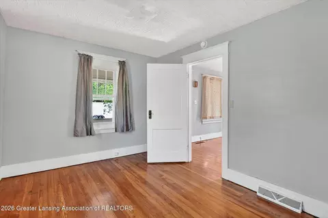 Bedroom - 702 E Cavanaugh Rd, Lansing, MI 48910 photo 2 of 5