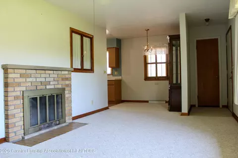 Living - 15418 Chetwyn Dr, Lansing, MI 48906 photo 2 of 3