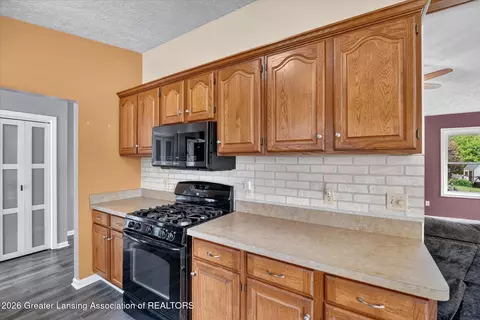 Kitchen - 620 Meade Dr, Lansing, MI 48917 photo 2 of 3