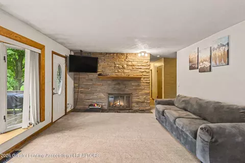 Living - 6950 Delta River Dr, Lansing, MI 48906 photo 2 of 2