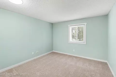 Bedroom - 4641 Gull Rd #61, Lansing, MI 48917 photo 1 of 3