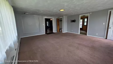 Living - 1323 E Willoughby Rd, Lansing, MI 48911 photo 2 of 12
