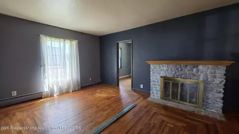Living - 1323 E Willoughby Rd, Lansing, MI 48911 photo 8 of 12
