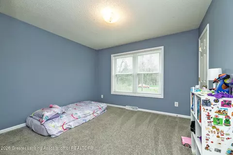 Bedroom - 606 Locust St, Dewitt, MI 48820 photo 3 of 4