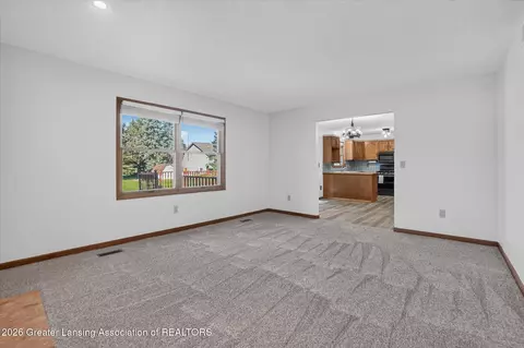 Living - 12382 Burlingame Dr, Dewitt, MI 48820 photo 4 of 5