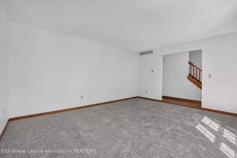 Living - 12382 Burlingame Dr, Dewitt, MI 48820 photo 2 of 5