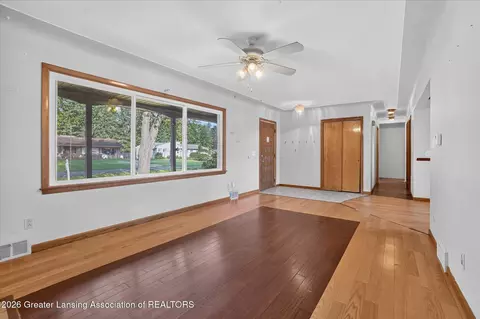Living - 15157 Pinehurst Dr, Lansing, MI 48906 photo 3 of 4