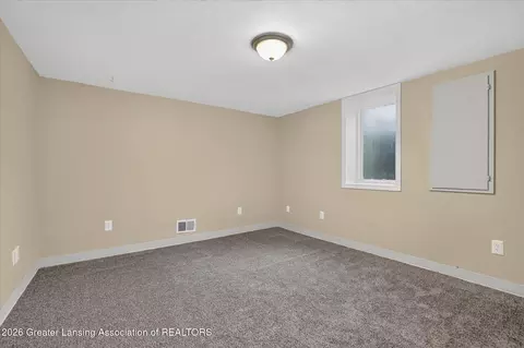 Bedroom - 15157 Pinehurst Dr, Lansing, MI 48906 photo 8 of 11