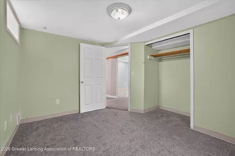 Bedroom - 15157 Pinehurst Dr, Lansing, MI 48906 photo 7 of 11