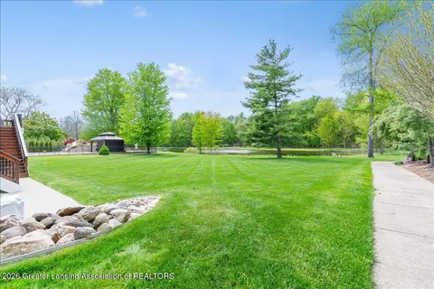 Exterior - 410 W Spring Meadows Ln, Dewitt, MI 48820 photo 5 of 15