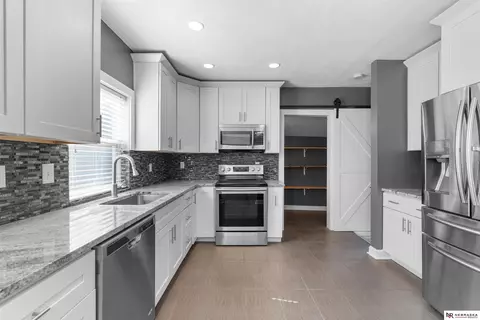 Kitchen - 327 E 7th St, Wahoo, NE 68066 photo 2 of 3