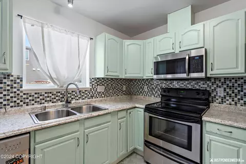 Kitchen - 5611 Alora Loop # 23, Anchorage, AK 99504 photo 2 of 3