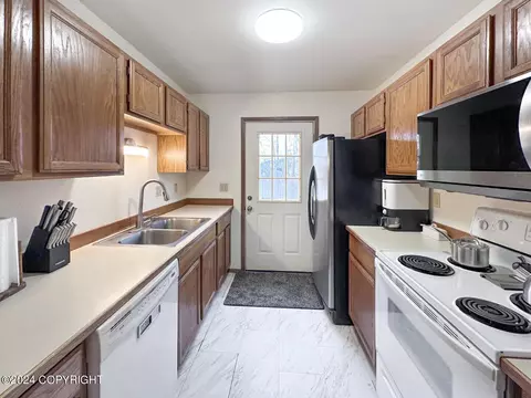 Kitchen - 10212 Thimble Berry Dr, Anchorage, AK 99515 photo 2 of 4