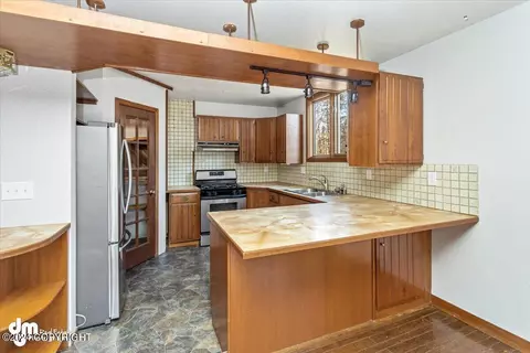 Kitchen - 15712 Shims St, Chugiak, AK 99567 photo 3 of 4