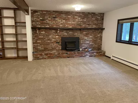Living - 7700 E 32nd Ave, Anchorage, AK 99504 photo 9 of 13