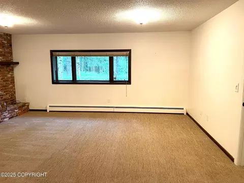 Living - 7700 E 32nd Ave, Anchorage, AK 99504 photo 11 of 13