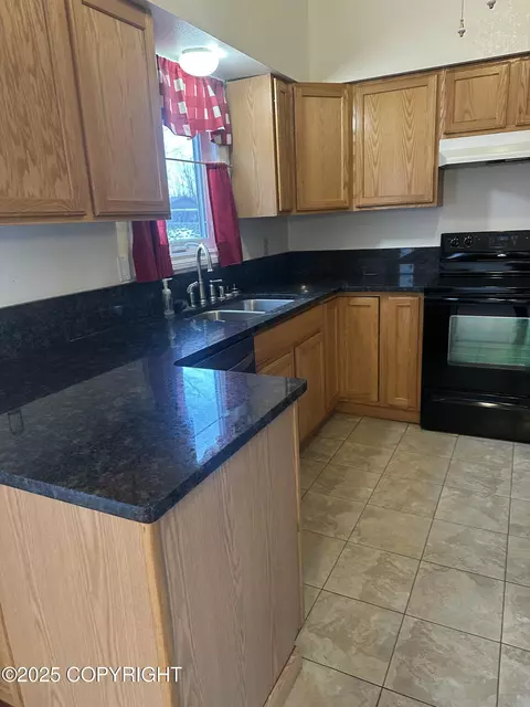 Kitchen - 18028 Teklanika Dr, Eagle River, AK 99577 photo 2 of 2