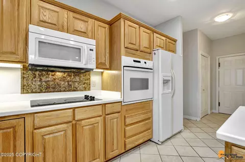 Kitchen - 9915 Middlerock Rd, Anchorage, AK 99507 photo 4 of 5