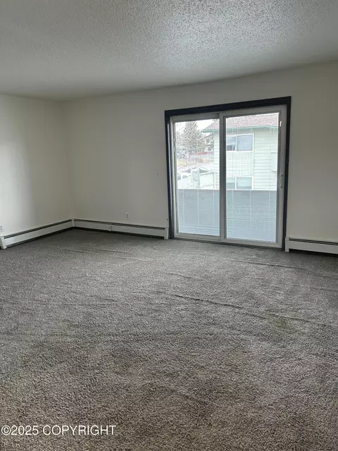 Living - 3940 E 9th Ave, Anchorage, AK 99508 photo 1 of 2