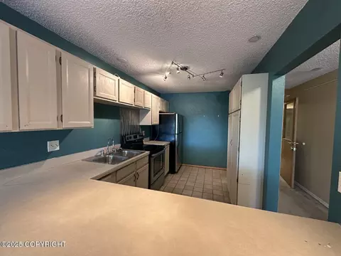 Kitchen - 1210 E 16th Ave # 3, Anchorage, AK 99501 photo 2 of 2