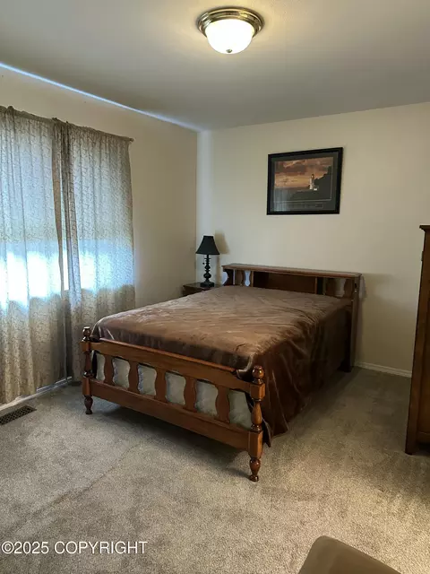 Bedroom - 17491 Fire Eagle Way # 6, Eagle River, AK 99577 photo 3 of 5