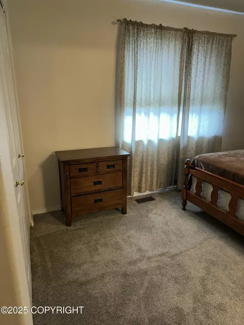 Bedroom - 17491 Fire Eagle Way # 6, Eagle River, AK 99577 photo 4 of 5