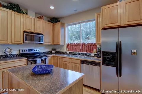 Kitchen - 20103 Riverside Dr # 1B, Eagle River, AK 99577 photo 3 of 3