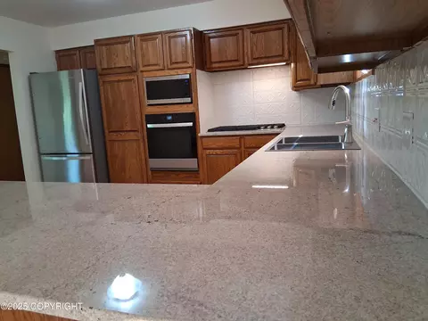 Kitchen - 25220 Schaff Dr, Chugiak, AK 99567 photo 6 of 6