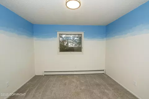 Bedroom - 18716 N Lowrie Loop, Eagle River, AK 99577 photo 5 of 8