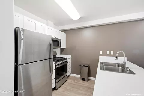 Kitchen - 111 E Potter Dr # 5, Anchorage, AK 99518 photo 3 of 5