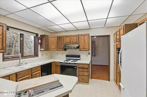 Kitchen - 6770 Round Tree Dr, Anchorage, AK 99507 photo 2 of 2