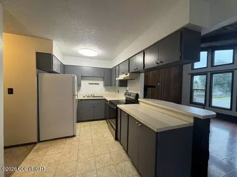 Kitchen - 341 Fireoved Dr, Anchorage, AK 99508 photo 2 of 2