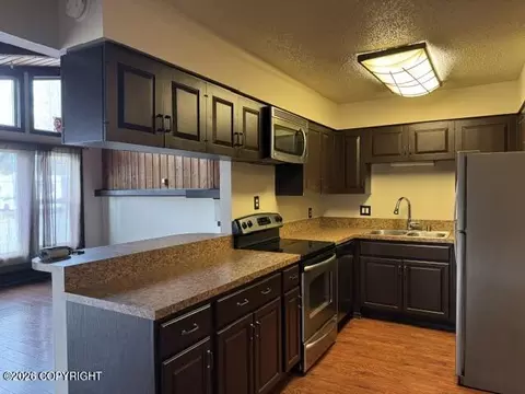 Kitchen - 341 Fireoved Dr, Anchorage, AK 99508 photo 1 of 2