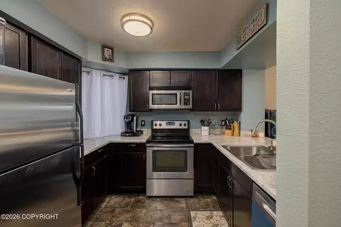 Kitchen - 457 Dailey Ave # E22, Anchorage, AK 99515 photo 2 of 2