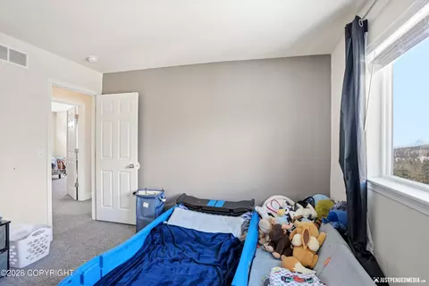 Bedroom - 2695 W River Dr, Eagle River, AK 99577 photo 8 of 10