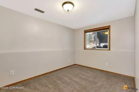 Bedroom - 7471 Clairborne Cir, Anchorage, AK 99502 photo 5 of 6