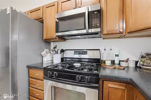 Kitchen - 11801 Falklands Dr # 75, Eagle River, AK 99577 photo 3 of 4