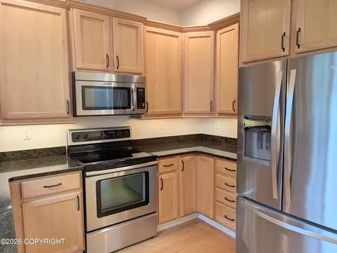 Kitchen - 20868 Trailhead Ave # 8, Eagle River, AK 99577 photo 7 of 7