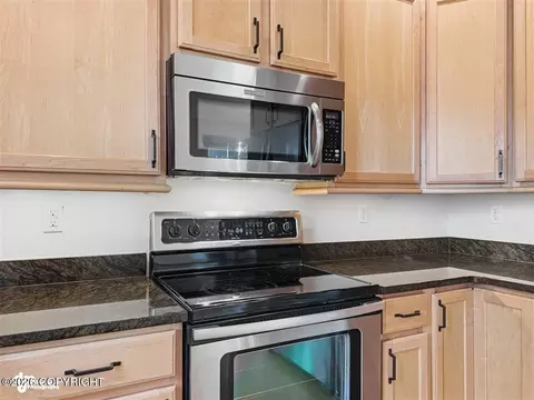 Kitchen - 20868 Trailhead Ave # 8, Eagle River, AK 99577 photo 4 of 7