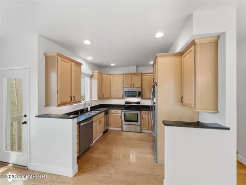 Kitchen - 20868 Trailhead Ave # 8, Eagle River, AK 99577 photo 1 of 7