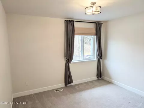 Bedroom - 20868 Trailhead Ave # 8, Eagle River, AK 99577 photo 5 of 9