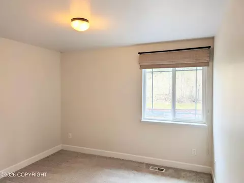 Bedroom - 20868 Trailhead Ave # 8, Eagle River, AK 99577 photo 8 of 9