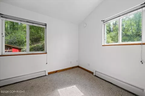 Bedroom - 19010 Upper Fish Hatchery Rd, Eagle River, AK 99577 photo 1 of 12