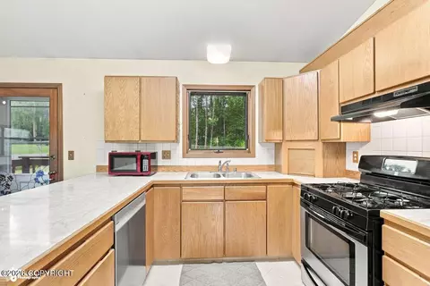 Kitchen - 21910 Sheltering Spruce Loop, Chugiak, AK 99567 photo 2 of 4