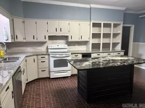 Kitchen - 100 E 13th St, Smackover, AR 71762 photo 2 of 3