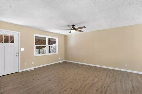 Living - 211 E Forsythe St, Pyatt, AR 72672 photo 2 of 3