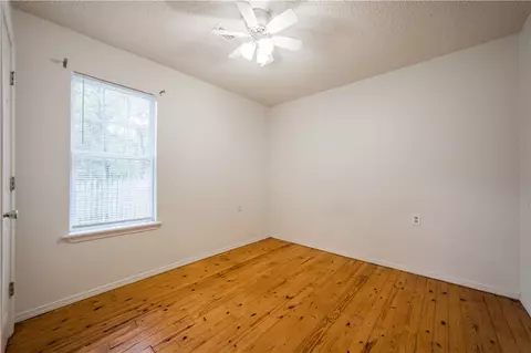 Bedroom - 121 129 Main St, West Fork, AR 72774 photo 7 of 8