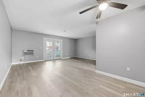 Living - 69 Sutton Pl #69, Bloomfield, CT 06002 photo 3 of 4