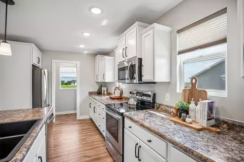 Kitchen - 1607 NE 2nd St, Stuart, IA 50250 photo 4 of 5